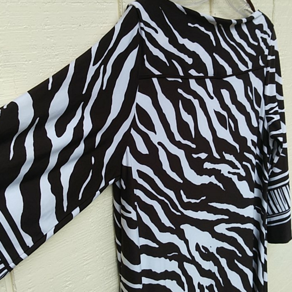 Women's zebra print dress. Love this dress. Just ready to rotate. 😊Poshing.